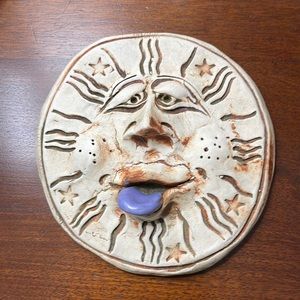 Hand sculpted moon face.